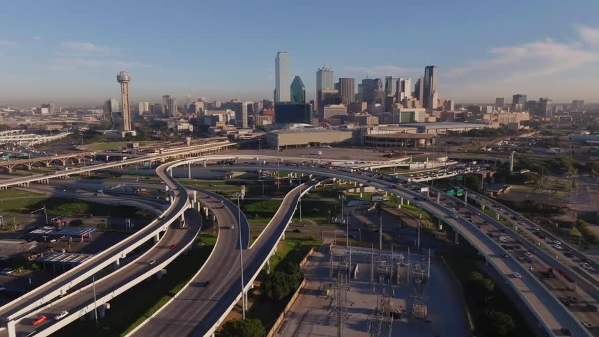 Aerial of the metropolitan city with heavy traffic on the road bridge