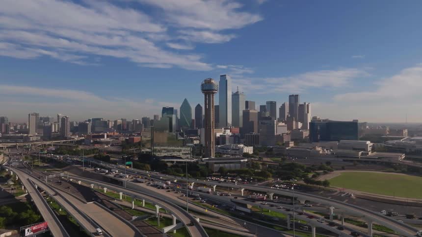 Aerial of the city with highway bridge with heavy traffic during the day