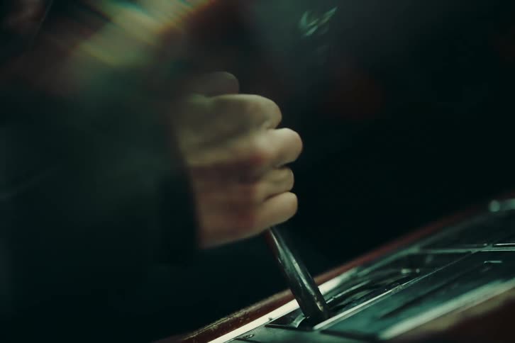 Closeup of a womans hands changing gears in a sports car