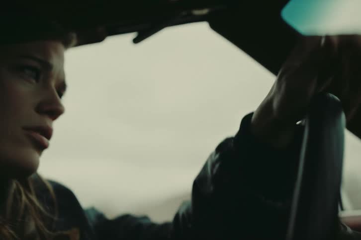 Portrait of a woman driving a car