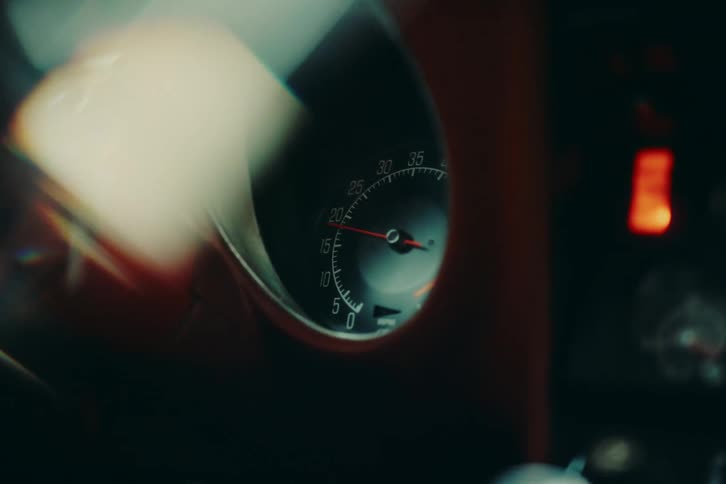 A cars speedometer moving