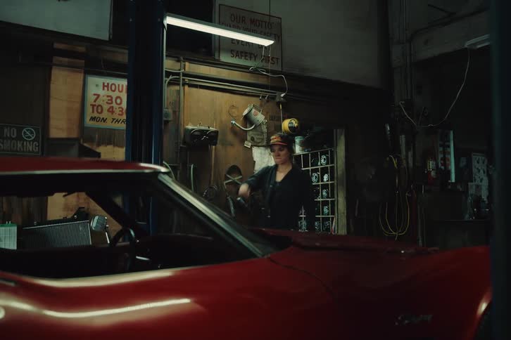 Mechanic opening the car hood and inspecting