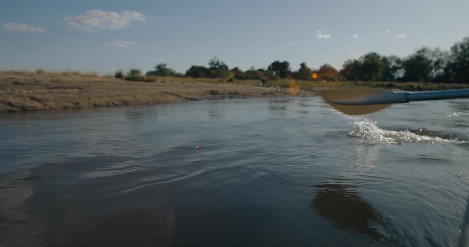 Man paddling a canoe on the river