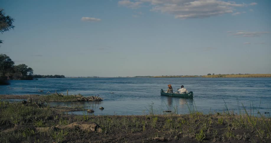 Canoe with a man and a woman in the middle of a lake