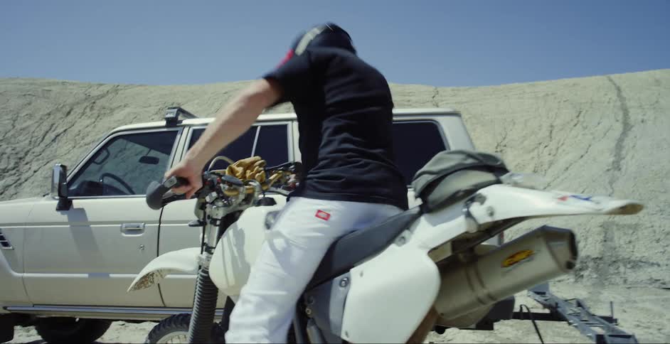 A clip of a man climbing a bike