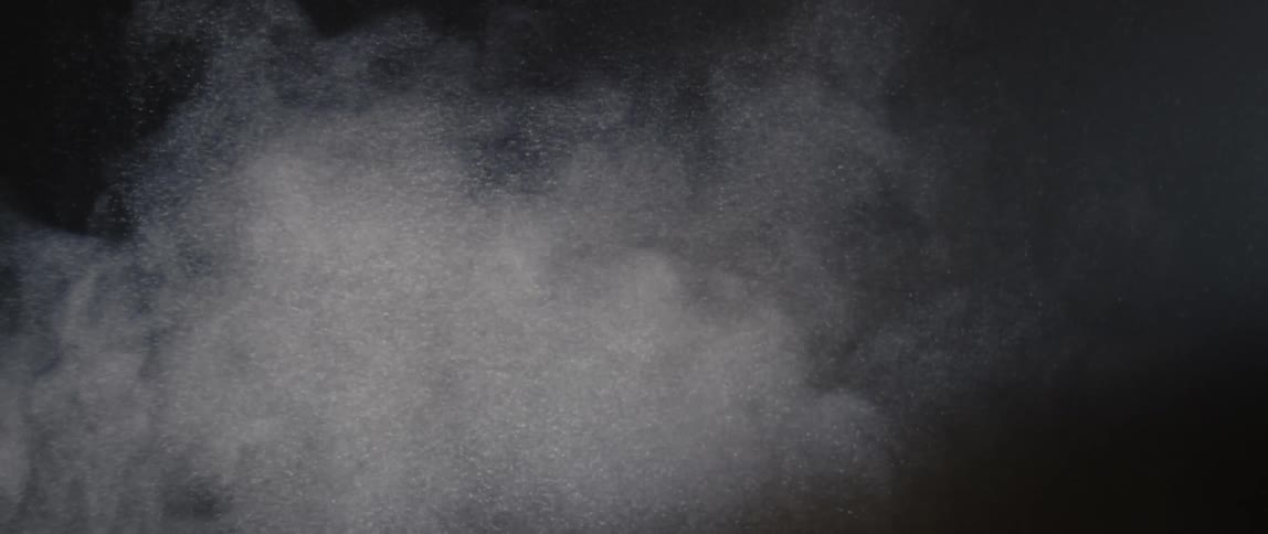 White powder in the air abstract in slow motion