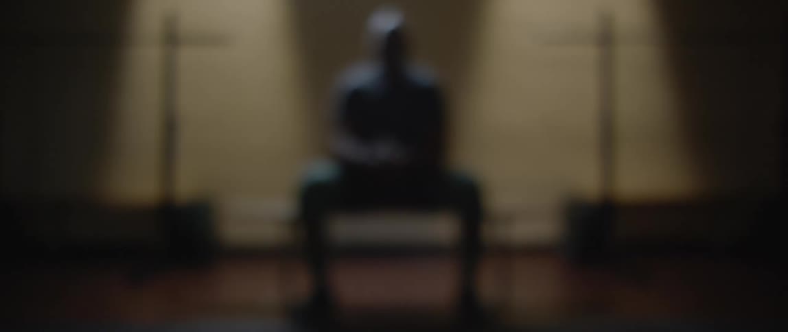 A blurred clip of a man sitting
