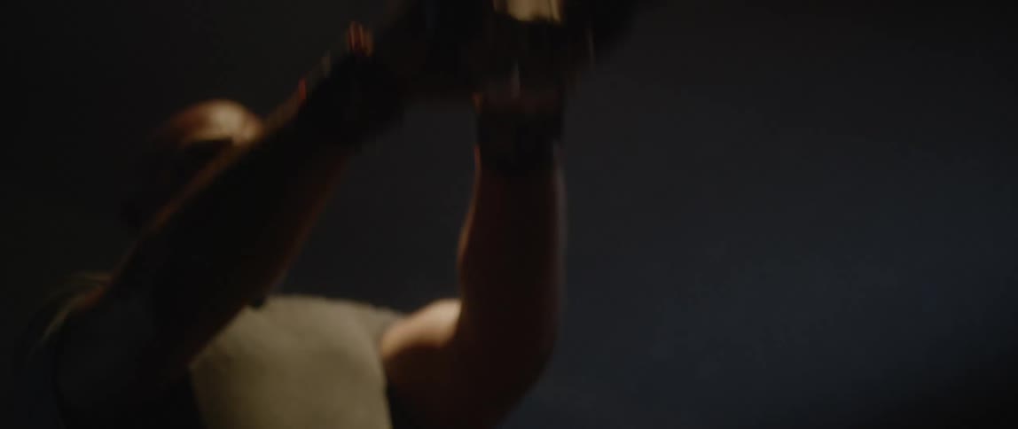 A man is lifting a weight with his hands