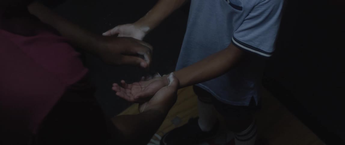Magnesium powder being applied to a boys hands