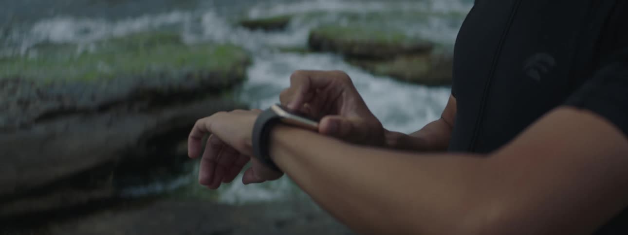 A clip of a man checking the time on his wristwatch