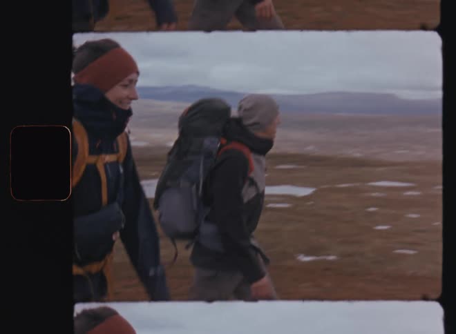 A clip of a female and male hikers walking together