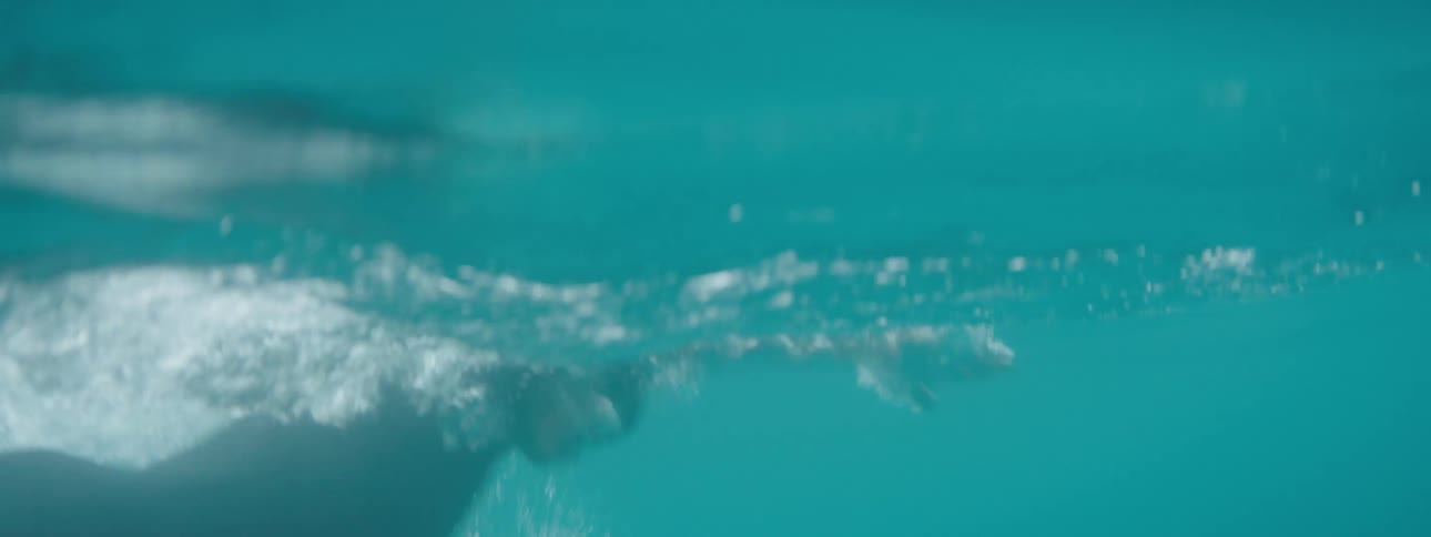 Man swimming in specific clothing