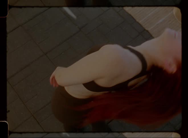 Woman tossing her hair up and spinning her head