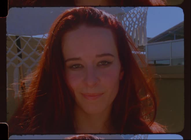 A beautiful white lady smiling at the camera