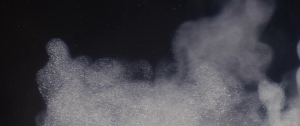 White abstract powder in the air in slow motion