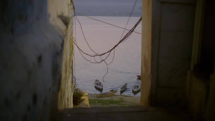 View of a corridor with the sea ahead and canoes