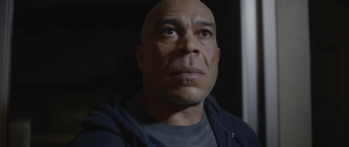 A clip of a man with a focused smile on his face