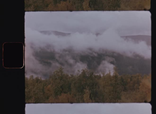 A clip of a cloudy and misty mountain