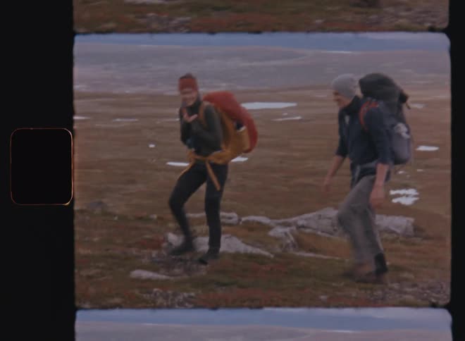 A man and woman are hiking together