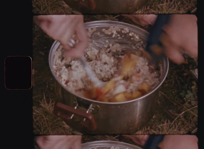 A clip of people cooking in a pot