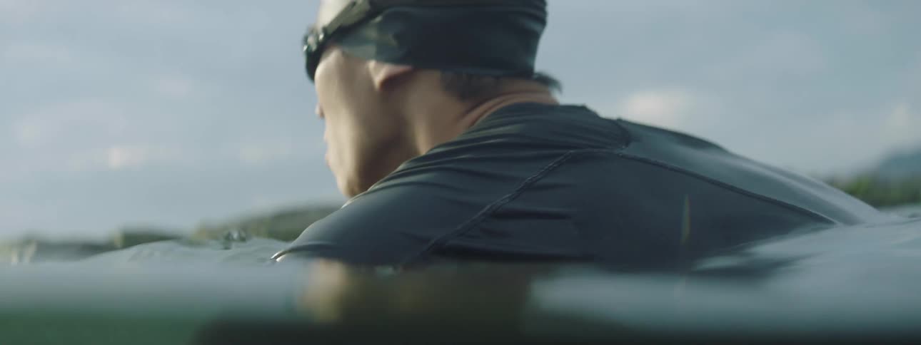 A man is swimming in the water