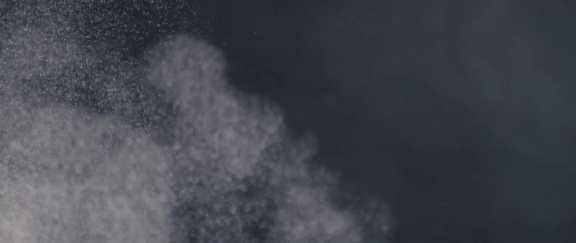 View of abstract white powder in slow motion