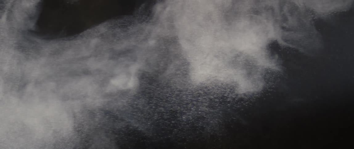 Abstract white powder flying through the air