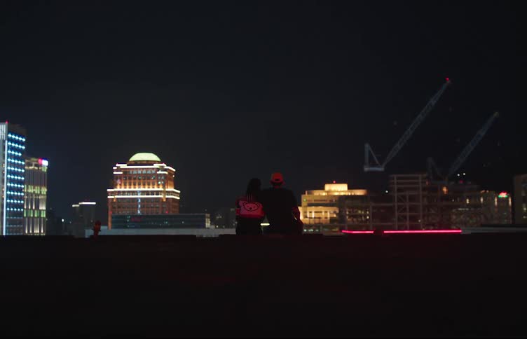 Couples sharing a romantic moment on a rooftop