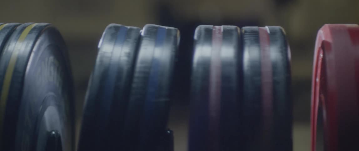 The sunlight reflects on the weights