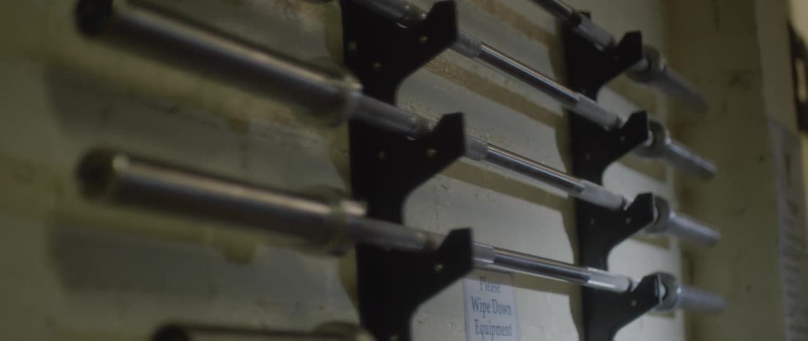 View of a wall with free weights in a gym