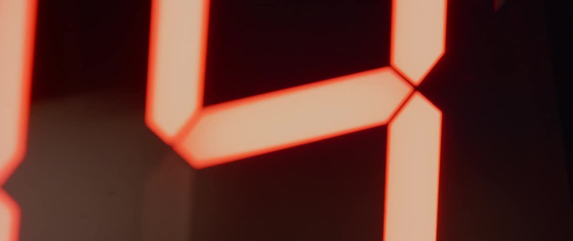 Red lines light up changing postion as numbers on a digital stopwatch count down