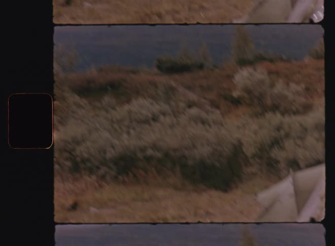 Woman cooking food in a pot amidst a mountain in nature