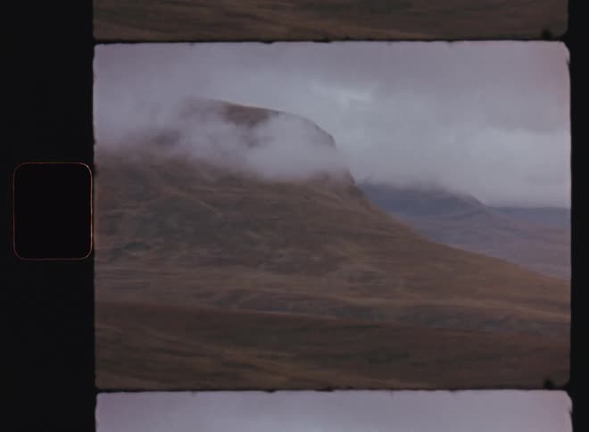 Panorama of a landscape with a mountain range and clouds