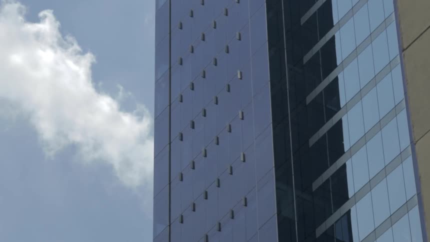 A tall building has a reflective surface