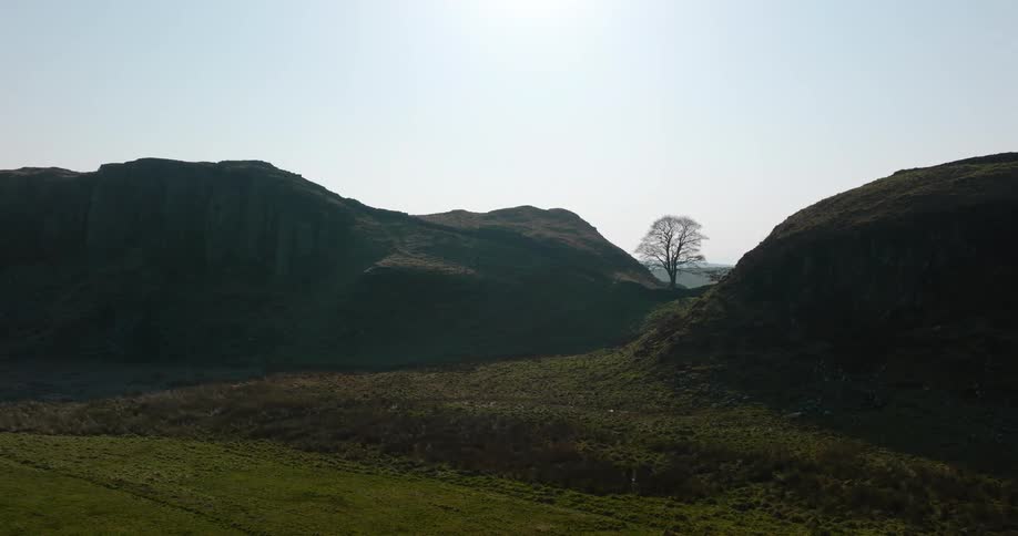Aerial panorama of a mountain range in the morning, Sycamore Gap