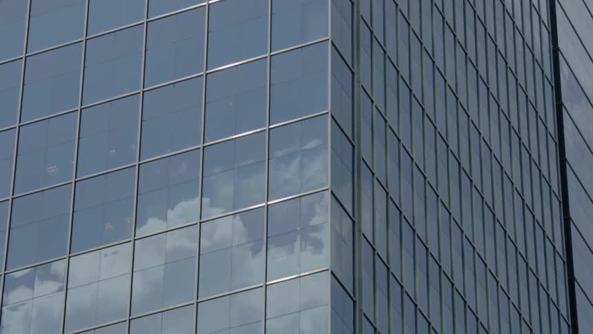 A building is covered with reflective windows
