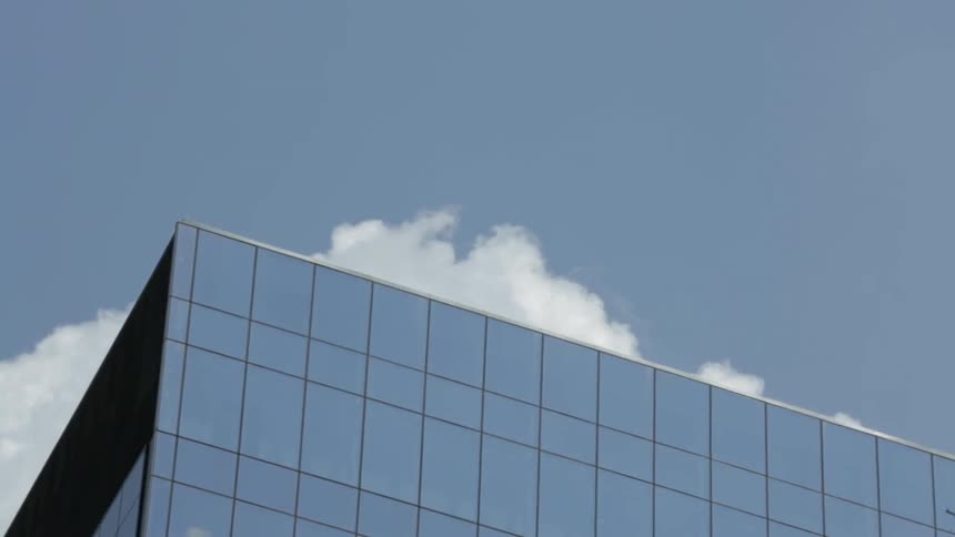 Clouds move over the top of a building