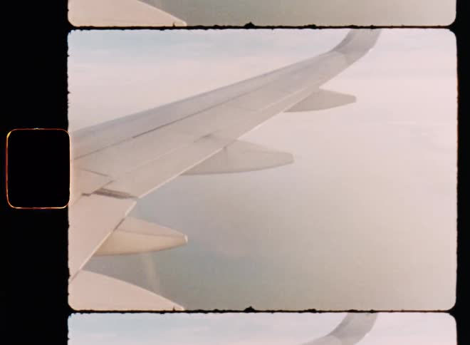 Aerial of cloudy sky airplane with a beam of sunlight