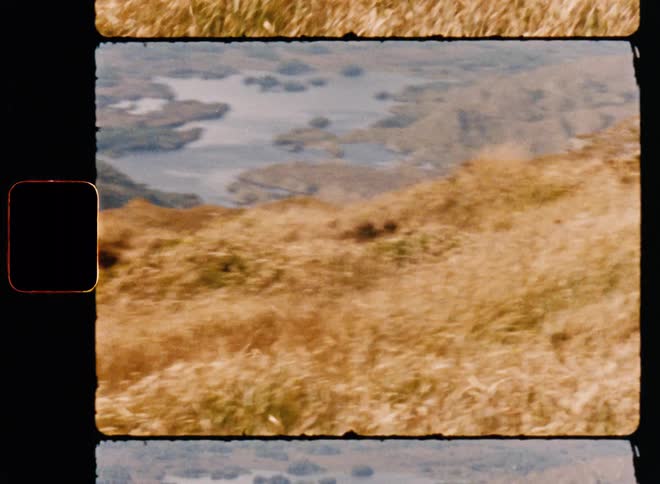A view of grass on some hills outdoors during the day