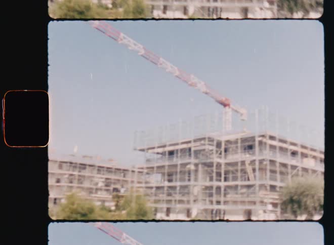 A building under construction in a suburban neighborhood