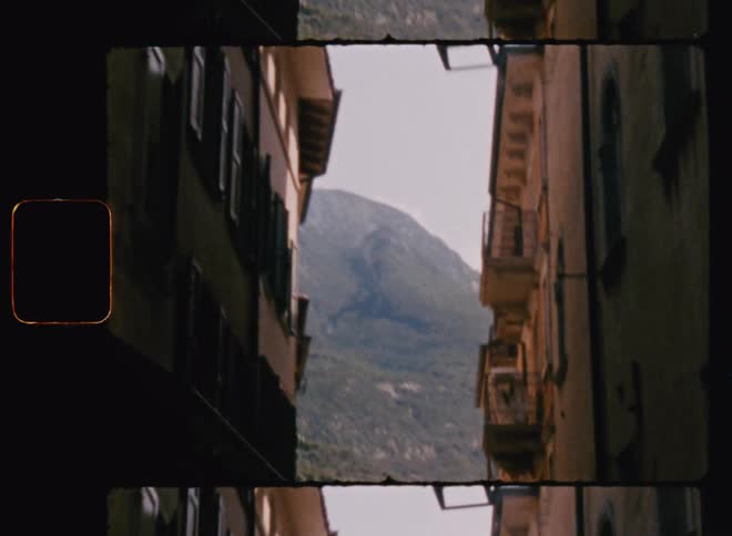 Apartments in a small town with mountains in the background