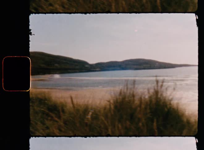 People swim in the sea by the beach at the bay on a sunny day
