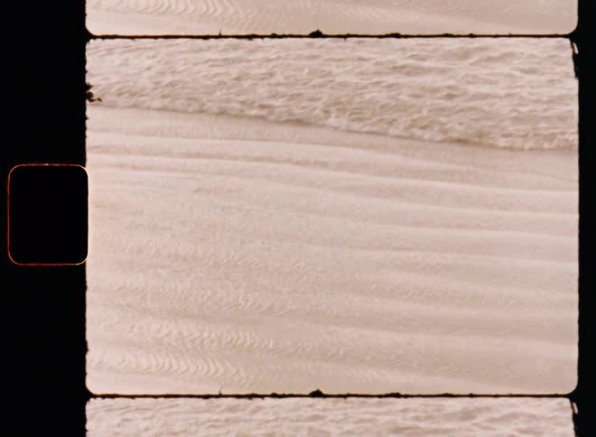 Gentle waves on the beach during the day