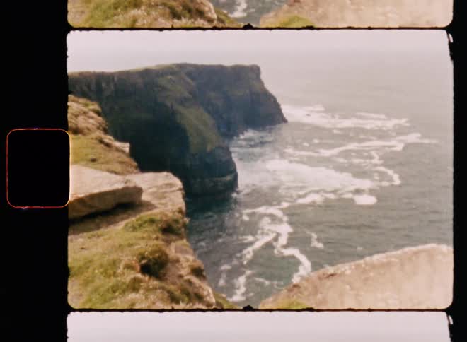 Rocky mountain coast with sea waves breaking on the shore