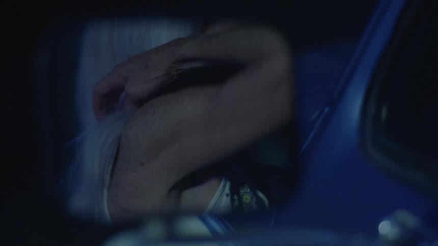 A woman getting out of the car