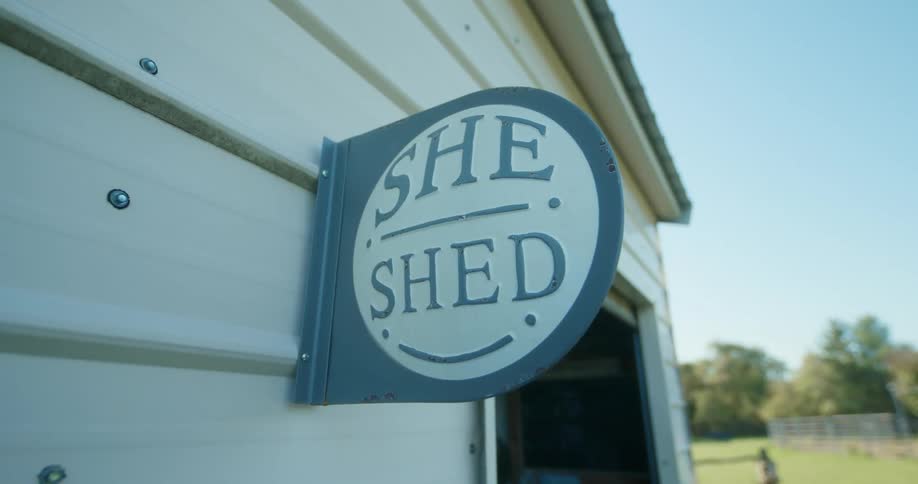 A plaque hangs on the wall of the house