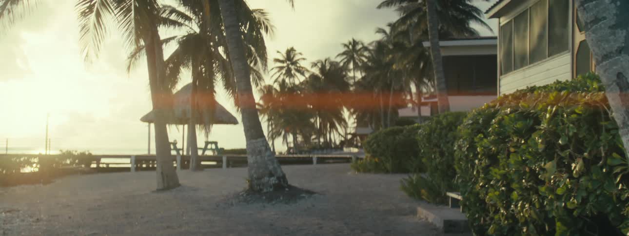 A resort in front of a beach at dawn