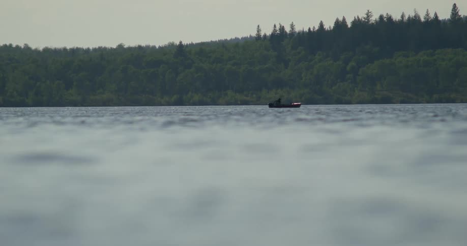 A person is traveling on a small boat