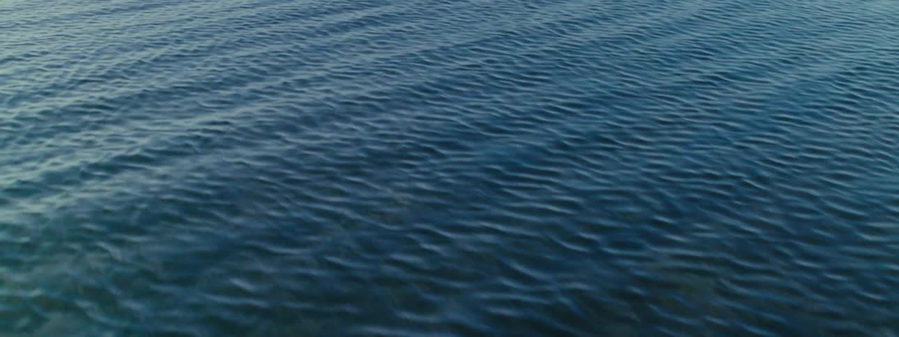 Aerial view of a body of blue water