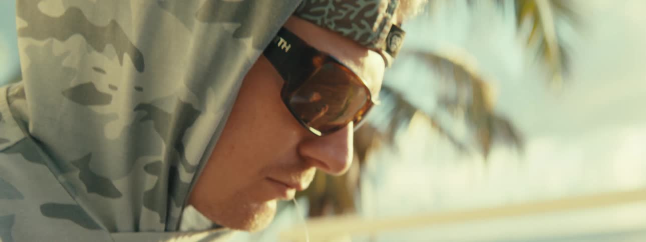 Closeup of a mans face wearing sunglasses
